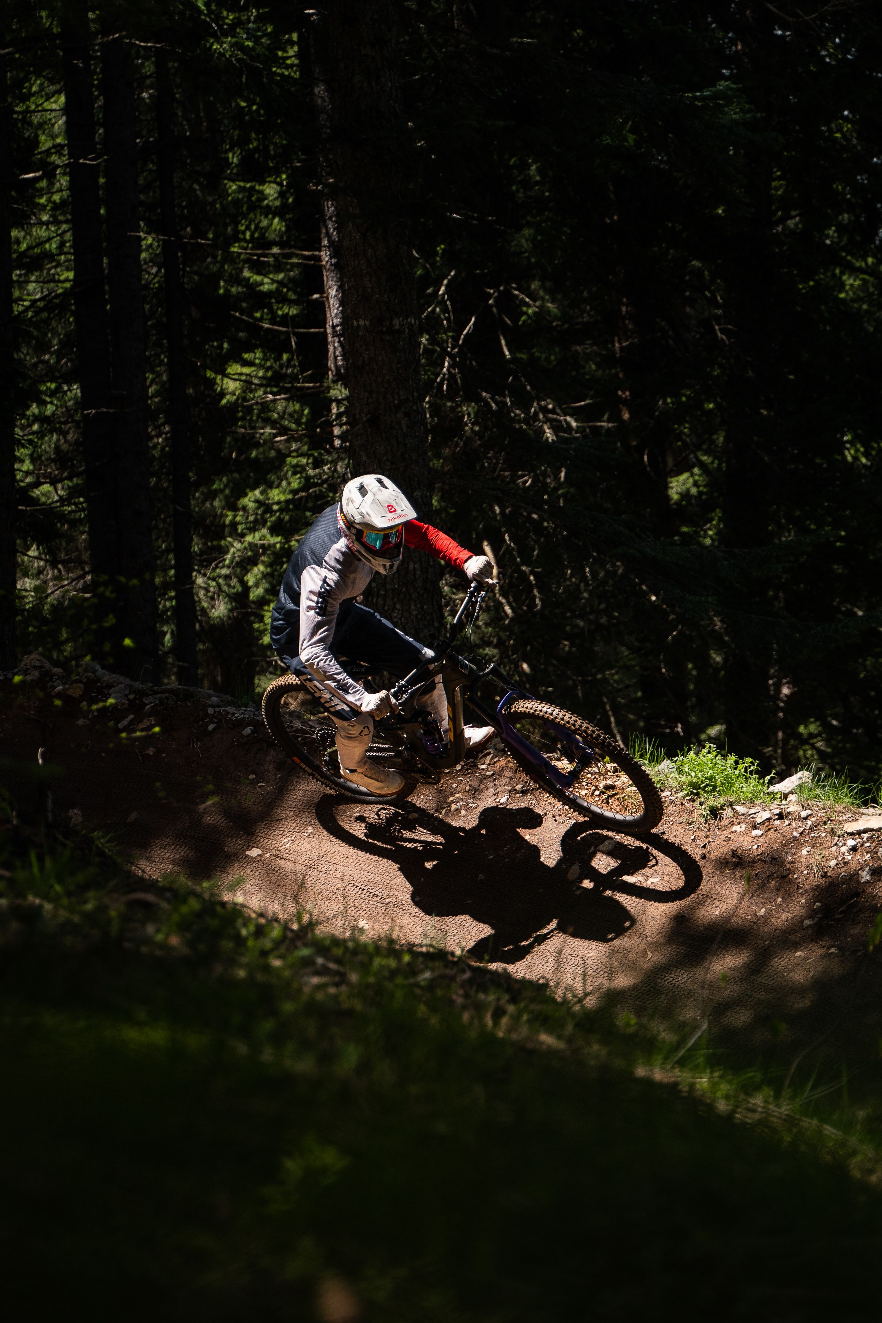Trail view at Paganella Bike Park with panoramic Dolomites scenery. Photo: Andrea Maranelli.