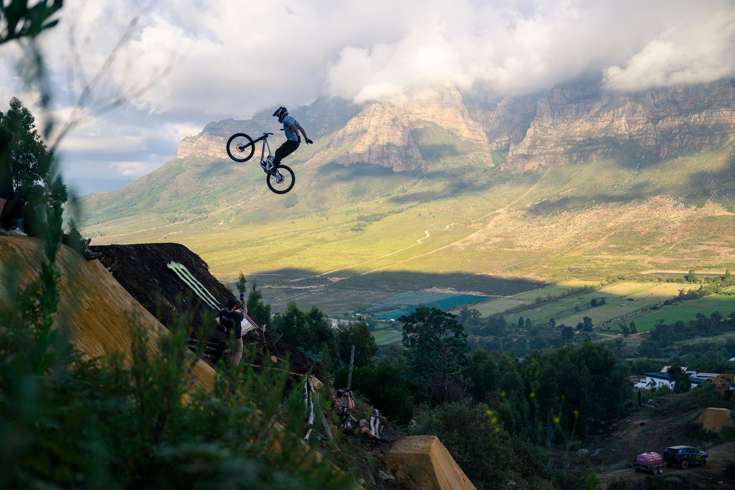 Rider tackling a technical jump at a bike park